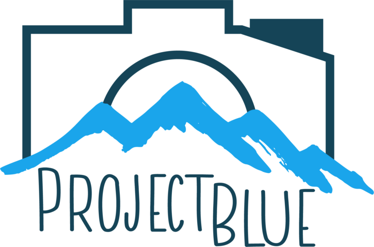 Project Blue Photography-Logo-Colored version of a camera with a mountain in front of it and the words Project Blue underneath the moutain